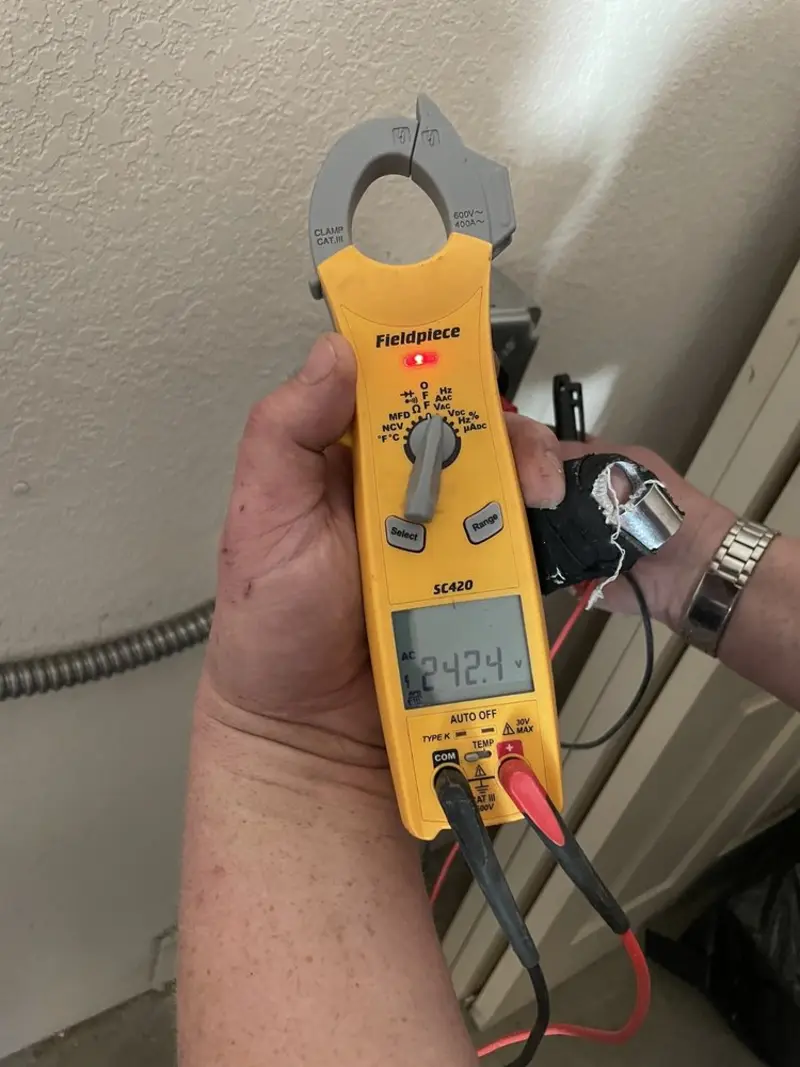 Voltage testing with clamp meter during Recessed Lighting Installation in Bay Village